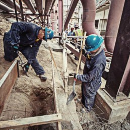 Workmen making a concrete form