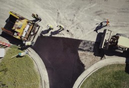 Asphalt paving of parking lot, aerial view.
