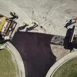 Asphalt paving of parking lot, aerial view.